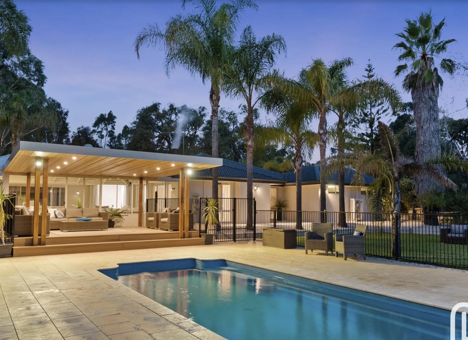 Below-ground saltwater pool and limestone paving